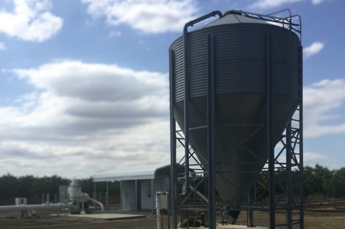 Dry storage silo for solution gypsum in the field.
