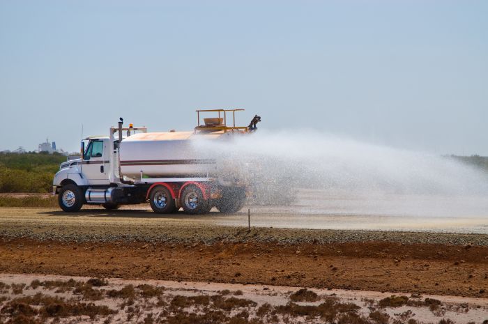 Water truck applying AgriGator dust suppressant. 